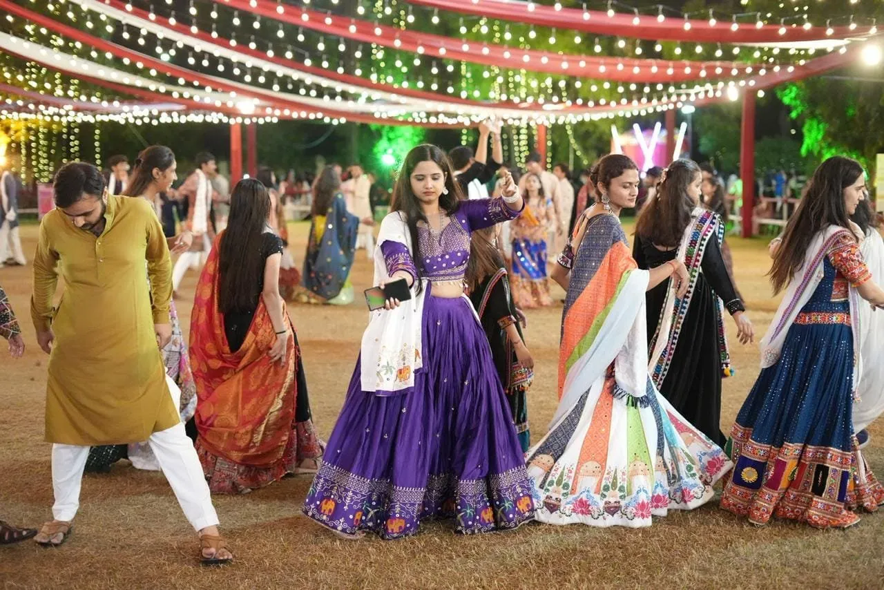 Students in traditional attire at a Navratri garba night at KNU